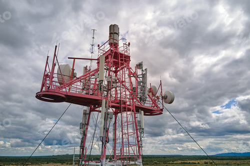 Preview: Aerial view of telecommunications cell phone tower with wireless communication antennas
