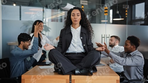 Preview: Calm businesswoman professional taking break meditating sitting at table in office meeting ignoring