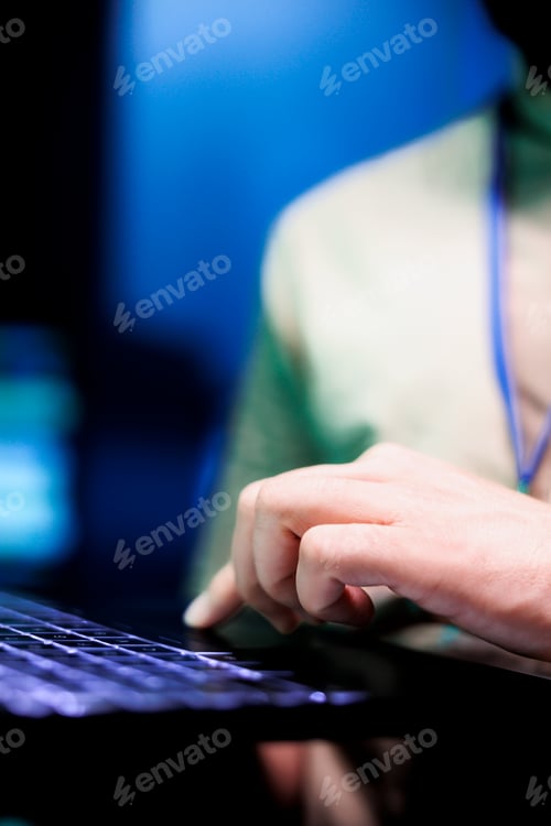 Preview: Engineer in data center using laptop