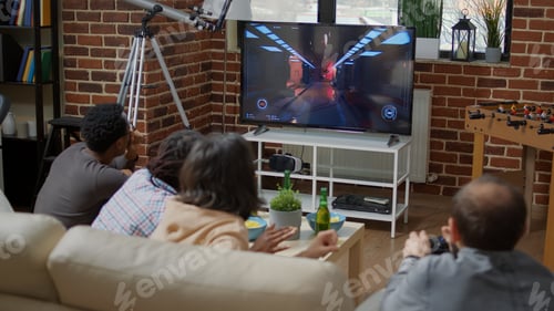 Preview: Young people playing video games together and losing