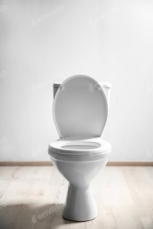 Preview: New ceramic toilet bowl near light wall