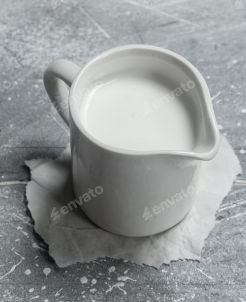 Preview: Milk in a cup on paper.