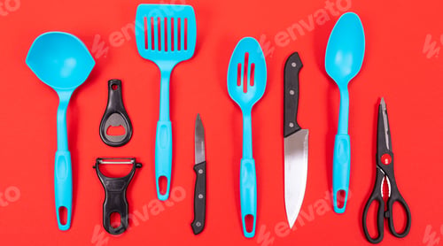 Preview: Cooking utensils in kitchen isolated on red background