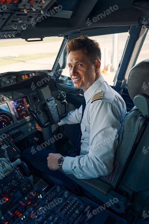 Preview: Pilot posing for the camera in the cockpit