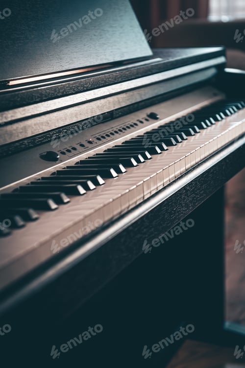 Preview: Close-up, electronic piano in a dark room.