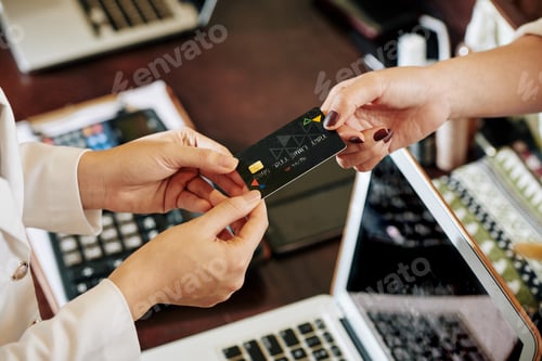 Preview: Woman paying with credit card