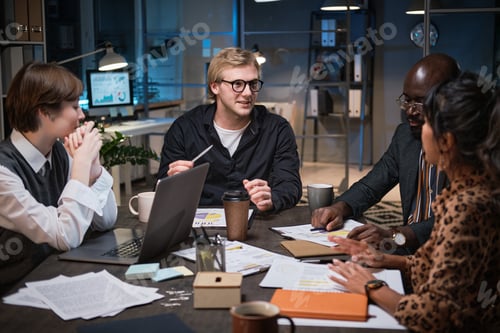 Preview: Business people working at office till night