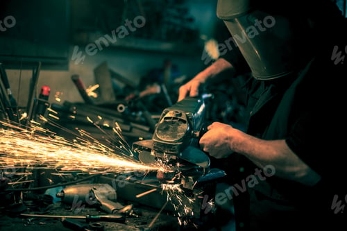 Preview: Metal grinding on steel spare part in workshop