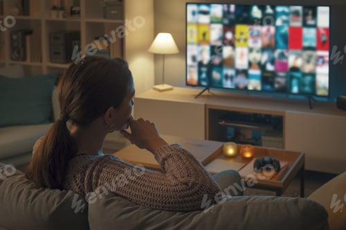 Preview: Woman choosing a movie on her television