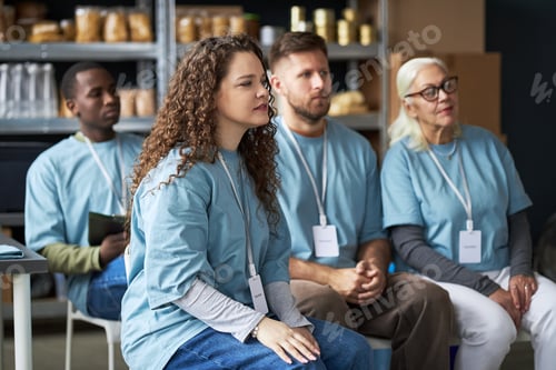 Preview: Group Gathering of Diverse Volunteers in Community Center