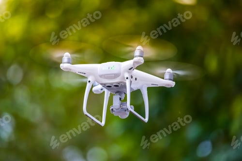 Preview: Drone is flying with digital camera to take photo and video on ground floor..