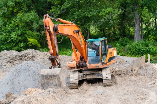 Preview: Excavator performs excavation work on the construction site. Yellow tractor digs the ground