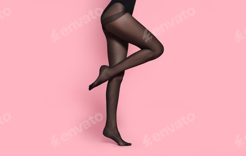 Preview: Woman wearing black tights on pink background, closeup