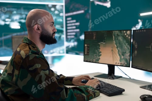 Preview: Man Working at Computers in an Office