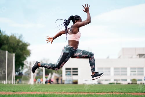Preview: African-American athlete sprinter jumping. Sport