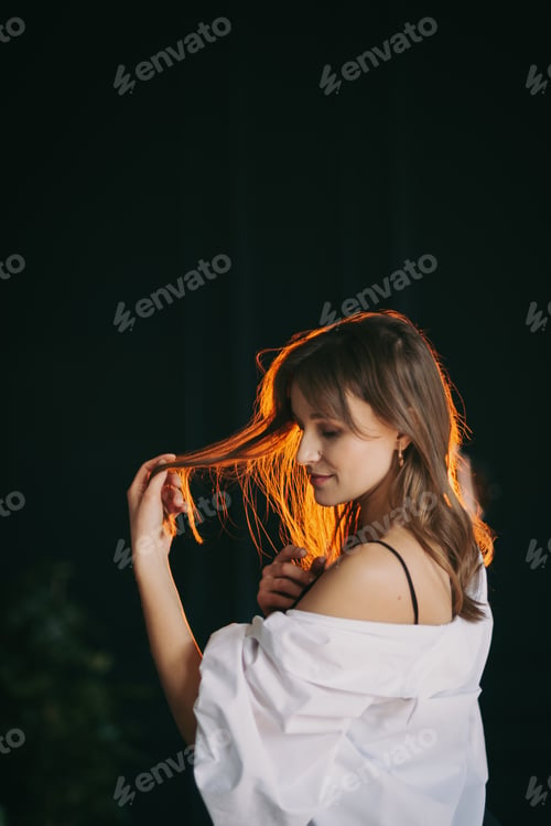 Preview: Beautiful Woman with Auburn Hair in Soft Light