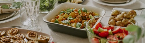 Preview: Header with Assorted Fresh Vegetables and Salads Arranged on Table for Family Gathering