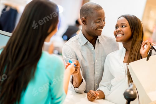 Preview: Happy Couple Shopping And Making Payment With A Credit Card