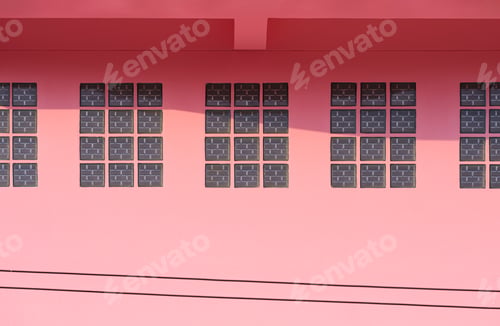 Preview: Glass brick blocks on pink concrete wall of vintage house with sunlight and shadow on surface