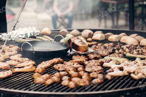 Preview: Grilled meat and vegetables mushrooms. roasting beef pork on big grill