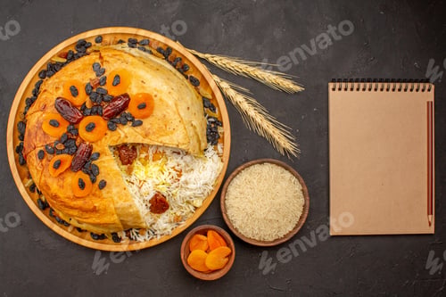 Preview: top view tasty shakh plov with raisins and dried apricots on a dark background rice dinner meal