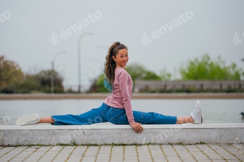 Preview: Portrait of a girl doing rhythmic gymnastics outdoors.