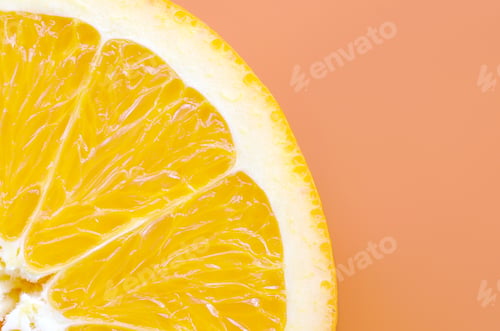 Preview: Top view of a one orange fruit slice on bright background in orange color
