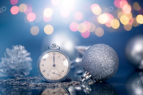 Preview: New Year's at midnight - Old clock with Christmas decoration and holiday lights
