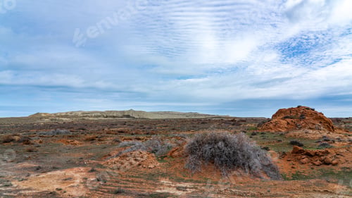 Preview: A pile of sand in a field