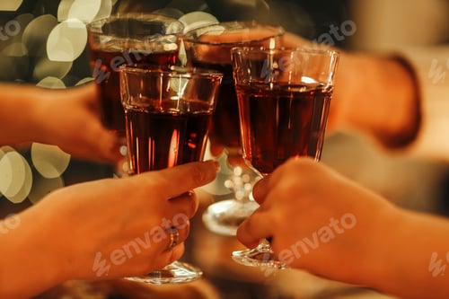 Preview: Family friends have fun together in winter eating food on a wooden table
