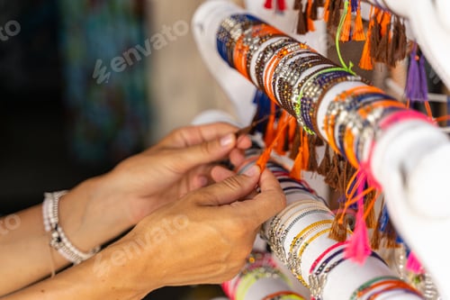 Preview: Girl purchasing local souvenirs during trip stock photo