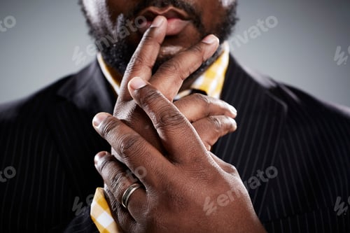 Preview: Close up studio portrait of mid adult businessmans hands