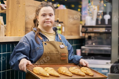 Preview: Confident Girl with Down Syndrome Working in Bakery