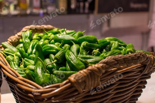 Preview: a basket of green peppers with a basket of green peppers.