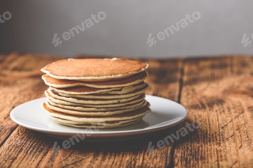 Preview: Stack of american pancakes on white plate