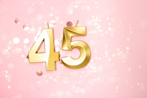 Preview: Number 45 forty five golden celebration birthday candle on Festive Background.