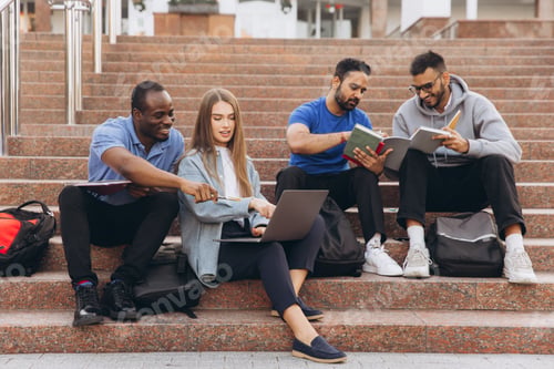 Preview: Diverse Group of Students Studying Together Outdoors on University Campus Steps with Laptops