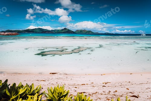 Preview: Tropical famous Anse Source d'Argent beach on sunny day on island La Digue in Seychelles