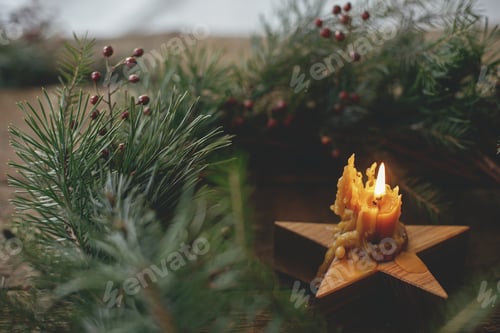 Preview: Christmas advent. Stylish rustic burning candle in christmas wreath on old wood. Merry Christmas