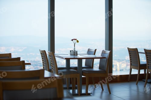 Preview: Cafe on roof top of a skyscraper at sunset