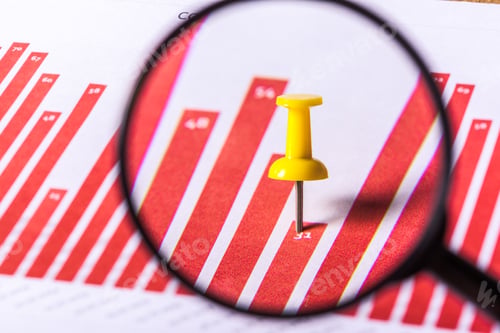 Preview: Magnifying glass and business growth graph