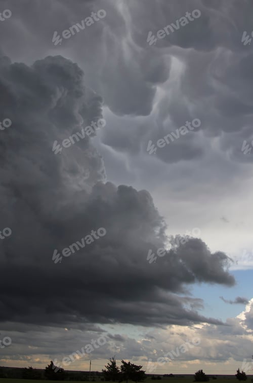 Preview: Dark storm clouds gather in a dramatic sky.