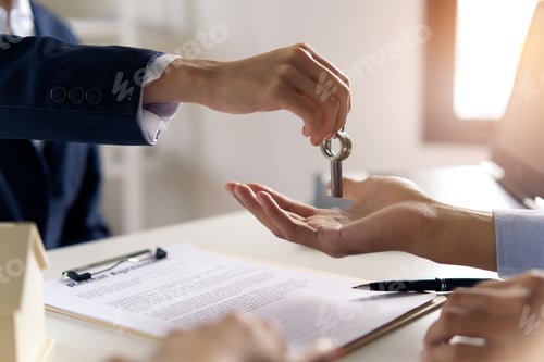 Preview: Young Asian couple making contract with house sale agency.