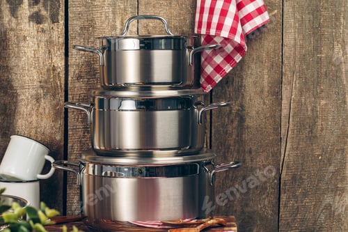 Preview: Set of stainless steel saucepans in a kitchen