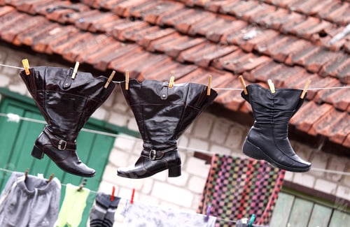 Preview: Wet shoes hanging on the clothesline along with other laundry