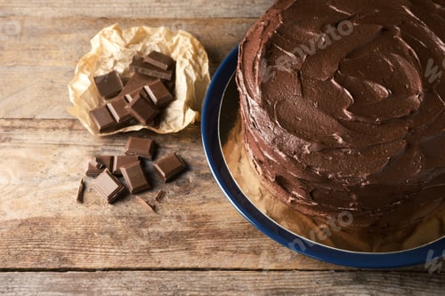 Preview: Composition with tasty homemade chocolate cake on wooden background