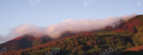 Preview: Minimalistic landscape. Cloud above a colorful mountain. Copy space.