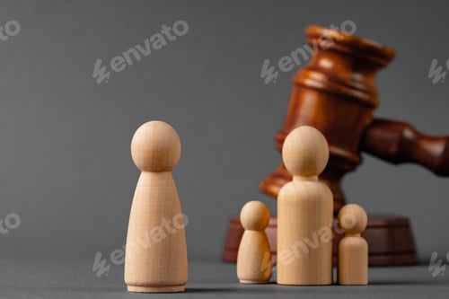 Preview: Wooden toy family and judge mallet. Family divorce concept