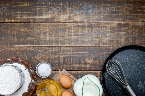 Preview: Food background with empty frying pan and ingredients for cooking on wooden table