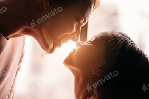 Preview: close-up shot of mother and daughter cuddling on sunshine background